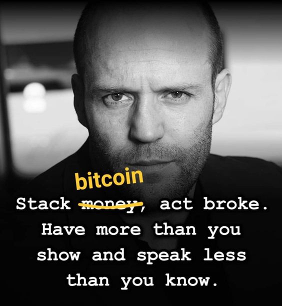 A black-and-white close-up portrait of Jason Statham with a serious expression is overlaid with the text "bitcoin" in yellow, followed by "Stack money, act broke. Have more than you show and speak less than you know." with "money" crossed out. The image visually reinforces the post's message about quietly accumulating Bitcoin without drawing public attention, embodying the "act broke" philosophy through Statham's stoic, understated demeanor.