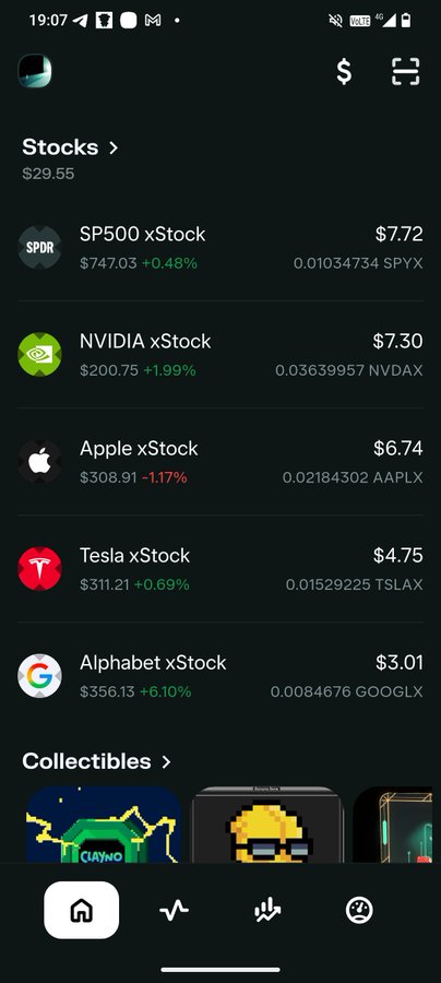 The image shows a mobile app displaying tokenized stock prices including SP500 xStock ($7.72), NVIDIA xStock ($7.30), Apple xStock ($6.74), Tesla xStock ($4.75), and Alphabet xStock ($3.01), with a "Collectibles" section visible at the bottom. However, the image does not visually relate to the post about $DIVVY or MyDivvyApp—instead it appears to showcase xStocks, which the post would likely be critiquing in favor of dividend-paying tokens like $DIVVY.