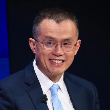 The image shows a man in a dark suit with a light blue tie, wearing glasses and smiling during what appears to be an interview or panel discussion setting. The caption suggests optimism about the crypto market entering a "golden period," though the image itself only shows the man and does not provide direct visual evidence of any market trends or crypto activity mentioned in the post.