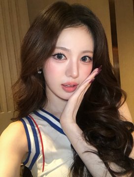 A young woman with long wavy brown hair poses with her hand against her cheek, wearing a white top with blue and red striped straps and a small earring. The image, tagged with "#Sui," appears to be a fan-style portrait, with the date "261010" likely referencing her birthday on October 26.