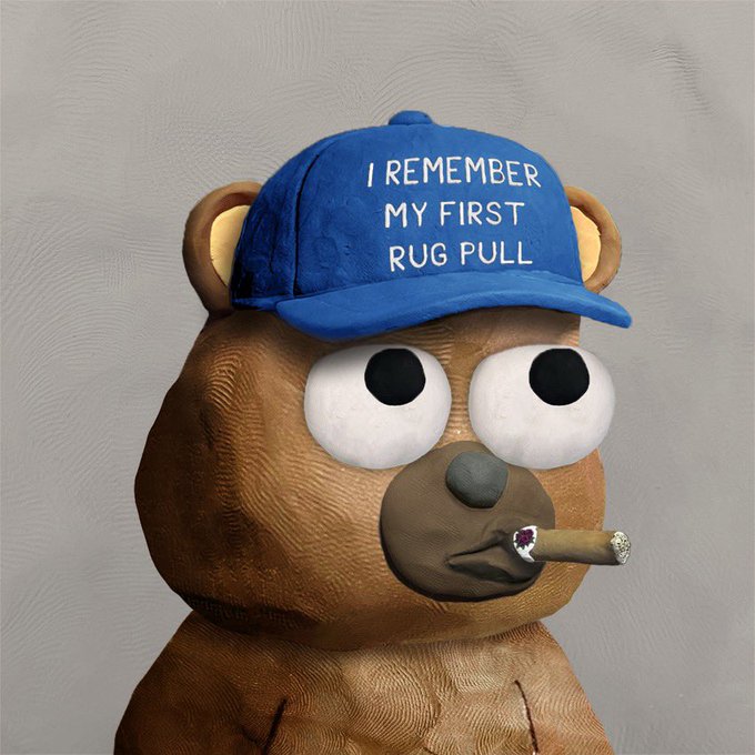 A brown teddy bear with googly eyes wears a blue cap reading "I REMEMBER MY FIRST RUG PULL" while smoking a lit cigar, humorously capturing the post's jab at investors ("jeets") who fall for crypto rug pulls, while praising @ClayStonKz for resilience.