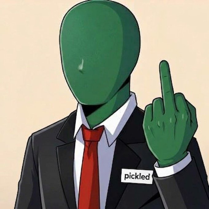 An illustration of a green, faceless humanoid figure in a black suit and red tie with a 'pickled' name tag, raising one finger in a gesture of caution or instruction.