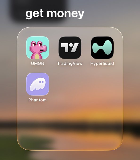 A phone home screen folder labeled 'get money' containing four apps: GMGN, TradingView, Hyperliquid, and Phantom, set against a sunset wallpaper.