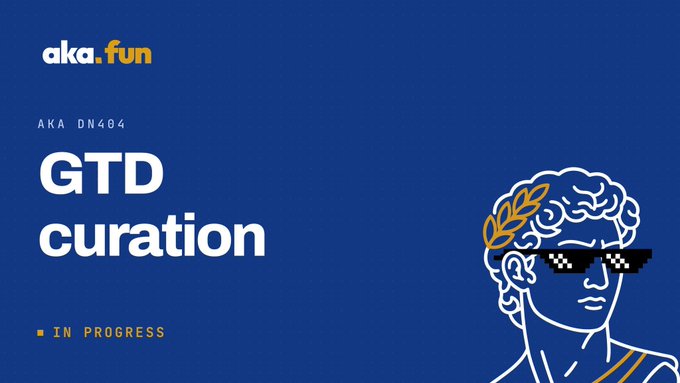 A blue promotional banner for aka.fun reading 'AKA DN404 GTD curation IN PROGRESS' with an illustration of a classical statue head wearing pixel sunglasses and a gold laurel wreath.