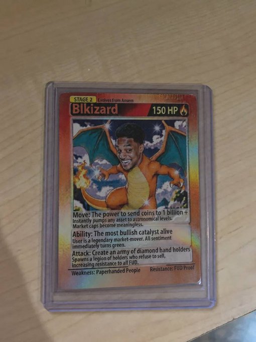 Custom Pokémon-style trading card named 'Blkizard', a Stage 2 evolution from Ansem with 150 HP, featuring the face of cryptocurrency figure Ansem superimposed on a Charizard-like body, with crypto-related attack descriptions.