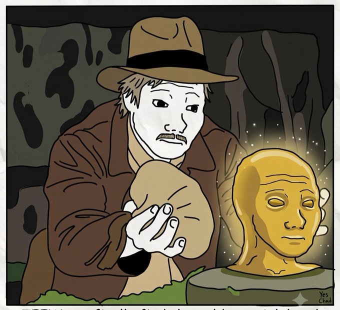 A cartoon drawing depicts a pale man in a brown trench coat and fedora hat examining a brown sack, sitting next to a glowing golden bust of a face in a dark setting.