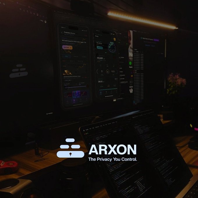 A promotional image for 'ARXON' with the tagline 'The Privacy You Control,' showing a dark desk setup with multiple monitors displaying financial dashboards and analytics.