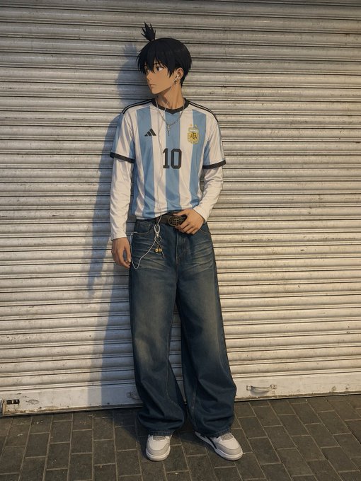 A young person poses in front of a metal shutter wearing an Argentina national football team jersey with the number 10 (a nod to Lionel Messi) paired with baggy jeans, captioned "gn legends, see ya tomorrow" as a stylish goodnight sign-off.