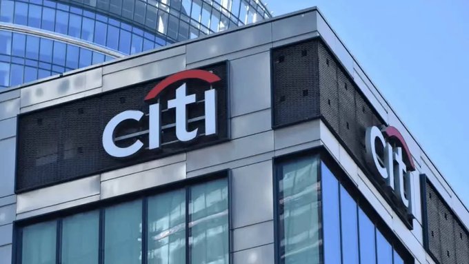 The exterior of a modern office building features the 'citi' logo with a red arc prominently displayed on its facade.