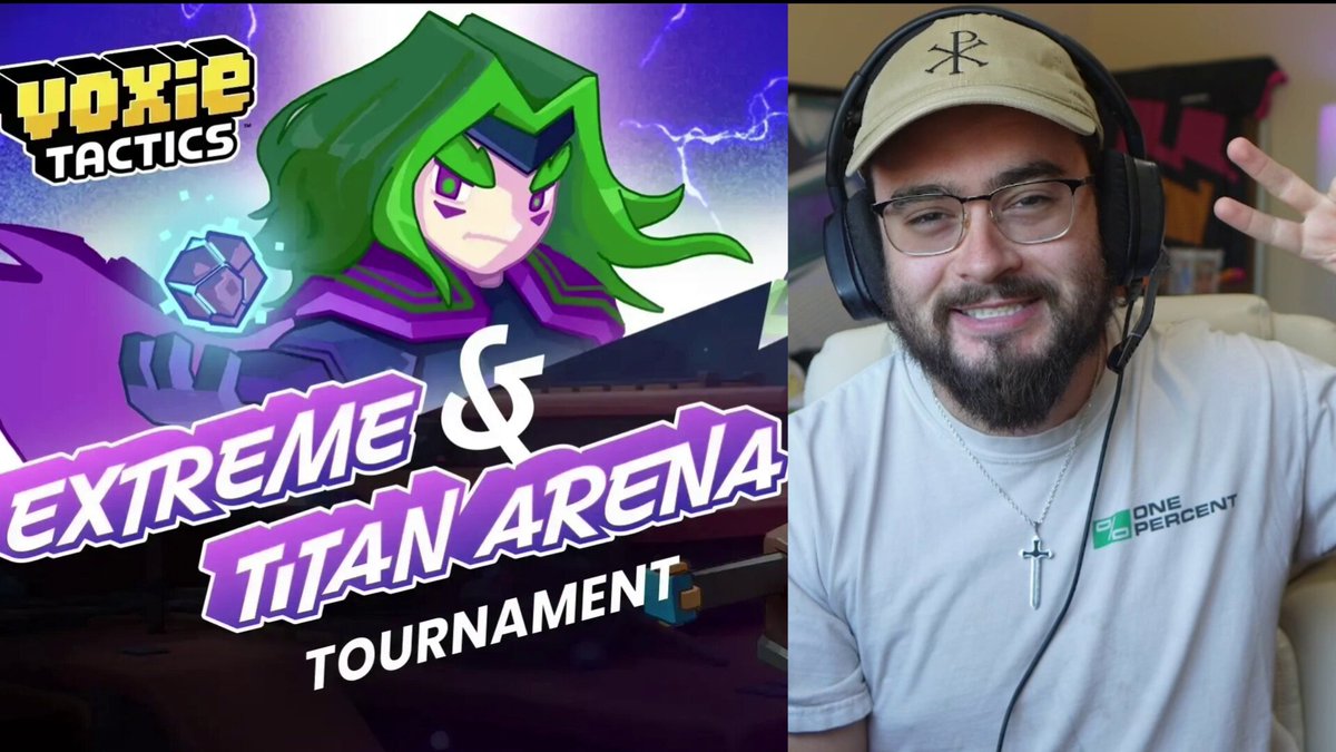 The image features a man wearing glasses, smiling at the camera while holding up his hands with peace signs. The background of the photo shows an advertisement for a video game tournament called "Extreme & Titan Arena" that takes place at the @VoxieTactics gaming company. The poster includes details about the competition and prizes available in the tournament.