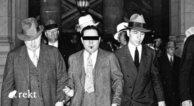 A black-and-white archival photo showing a group of suited men in fedoras, with the central figure holding a cigar, evoking the imagery of Prohibition-era gangsters — fitting the "Nostra" (mob) theme of the Nostra Finance oracle manipulation exploit on Starknet that allowed a $3.5 million undercollateralized borrow via a rigged price feed.