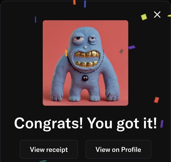 A 'Congrats! You got it!' screen celebrating a successful acquisition or win, featuring a blue clay-like monster figurine with gold teeth and buttons for 'View receipt' and 'View on Profile'.