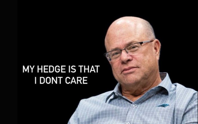 A meme featuring an older bald man with glasses and the text 'MY HEDGE IS THAT I DONT CARE' written in white on a black background.