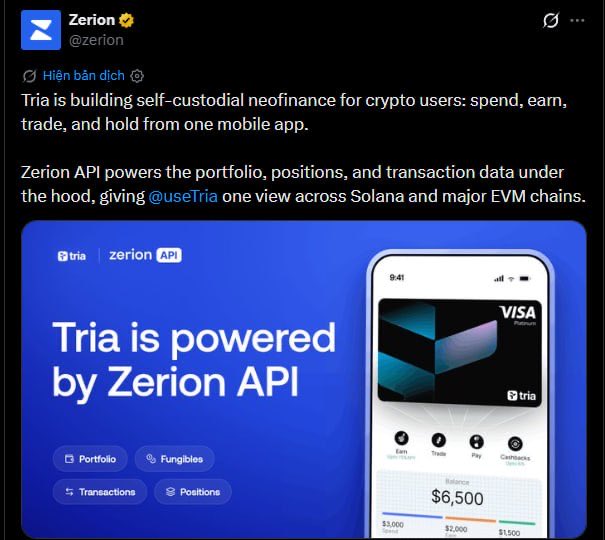 A tweet from Zerion (@zerion) announcing 'Tria is building self-custodial neofinance for crypto users' with a promotional image stating 'Tria is powered by Zerion API' showing a mobile app interface with a Visa Platinum card and $6,500 balance.