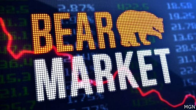 A stock market graphic displaying the words 'BEAR MARKET' in large orange and white LED-style letters, overlaid on a background of a declining red stock chart and financial data numbers, with an MGN watermark.
