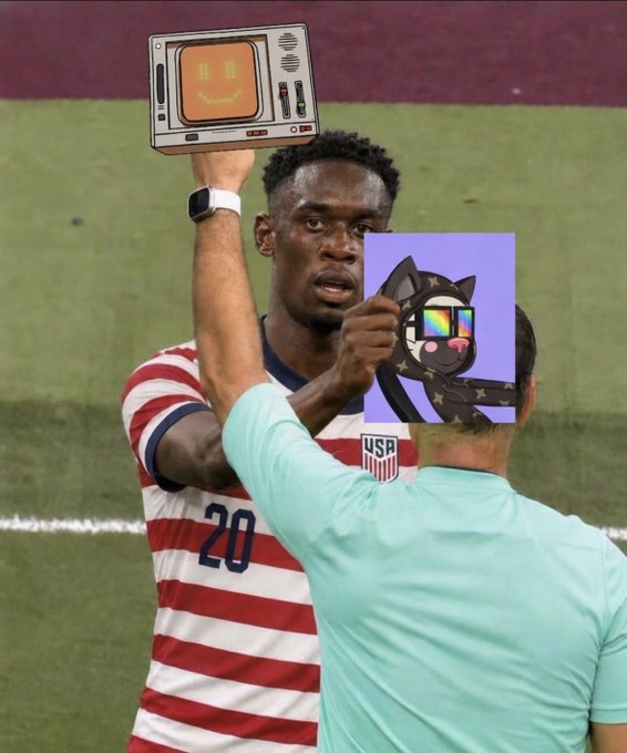 A soccer player in a USA #20 red and white striped jersey holds up a small TV-like device with a smiling orange face; in the foreground, a person in a mint shirt holds up a purple card displaying a cartoon cat with sunglasses and stars.