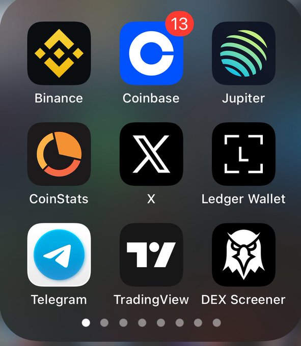 The image shows a phone screen displaying various cryptocurrency-related apps, including Bitcoin, Coinbase, Jupiter Coin, and others. The apps are arranged vertically, with each app having its own distinct icon representing its purpose or function within the world of cryptocurrencies. The user interface is clean and organized, making it easy to navigate through the different options available on their phone screen.