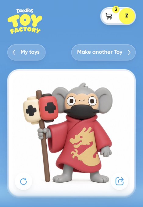 A screenshot from the "Doodles Toy Factory" app showcases a 3D character creation featuring a gray monkey mascot dressed in a red robe with a yellow dragon emblem, holding a staff with controller-like attachments. The interface includes "My toys" and "Make another Toy" buttons, along with a shopping cart icon displaying the number "3" and a profile icon marked "Z," reflecting the user's tweet about designing their ChimpersHQ character.