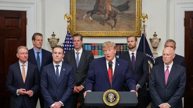 President Donald Trump stands at a podium bearing the Presidential Seal, addressing a group of men in business attire in what appears to be the Roosevelt Room of the White House, with a painting of a horse and rider visible on the wall behind them. The image accompanies a post advocating for clear cryptocurrency regulations in the United States, suggesting the photo captures a moment related to discussing crypto policy and regulatory framework.
