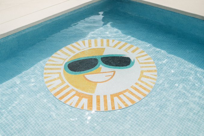A swimming pool features a vibrant mosaic of a smiling sun wearing sunglasses, serving as a visual pun on "SUN.io" — the TRON-based DeFi platform highlighted in the post for its record-breaking stablecoin swap performance and growing Total Value Locked.