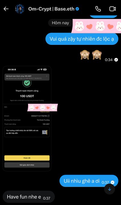 A screenshot of a Messenger chat with Om-Crypt | Base.eth showing a successful "100 USDT" funding transaction screenshot being shared, along with playful pink bunny and bear stickers, while the recipient expresses gratitude in Vietnamese ("Vui quá zậy tự nhiên dc lộc a" and "Ui nhiu ghê a oi"). The image captures the moment of receiving the $100 USDT gift referenced in the caption.