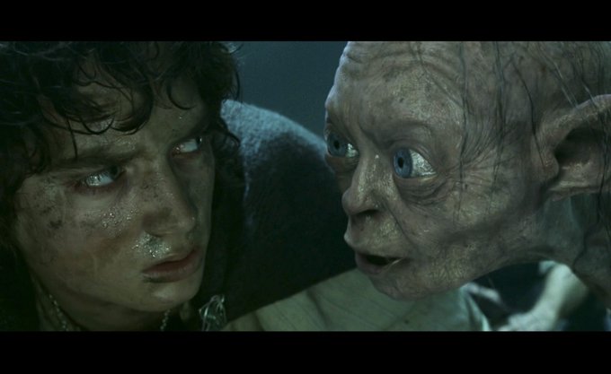 The image shows a scene from "The Lord of the Rings: The Return of the King" featuring Frodo and the pallid, wide-eyed creature Gollum whispering intently in his ear. 

This ties to the post about FOMO in a humorous, dramatic way—Gollum's obsessive, conspiratorial whispering to Frodo visually captures that nagging, creeping feeling of missing out on the $SPCX CFO's remarks, as if an inner voice is pressuring you not to be left behind.