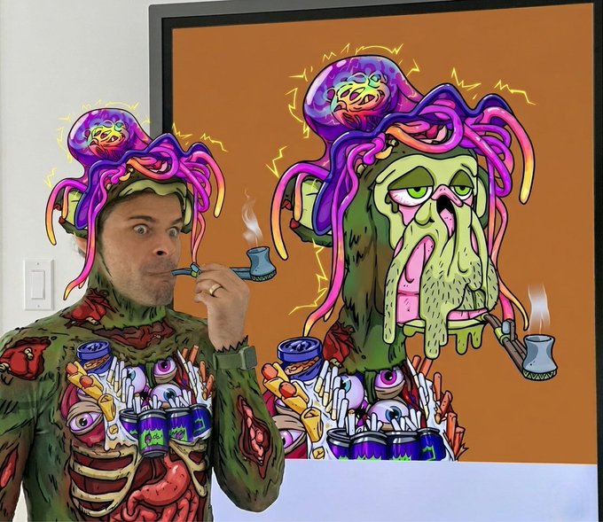 The image features a man dressed up as a character from a comic book or movie, wearing a costume with a green shirt and purple hat. He has a pipe in his mouth and appears to be smoking. The background of the image shows a large painting of an alien creature, possibly a monster or a robot, which is displayed on a wall behind the man. The caption at the bottom of the image reads "always enjoyed @g13 's cosplay series honoured to have my ape played by him today best club and friends in the world @BoredApeYC".
