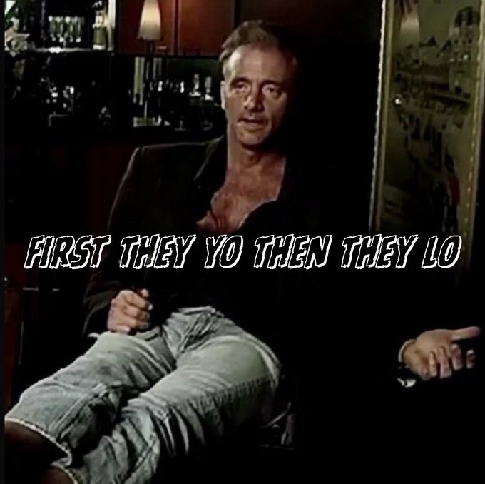 A meme image of a man in a black shirt sitting on a chair with the text overlay 'FIRST THEY YO THEN THEY LO'.