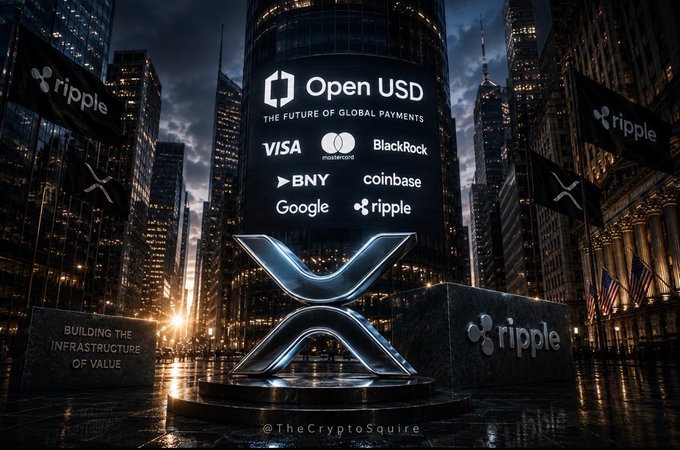 A dark, cinematic image of a towering building in a city center at night, displaying a large "Open USD — The Future of Global Payments" sign alongside partner logos from Visa, Mastercard, BlackRock, BNY, Coinbase, Google, and Ripple, with a glowing XRP symbol monument in the foreground and Ripple flags lining the plaza. The image visually reinforces the post's message that Ripple is positioning itself alongside the world's largest financial and tech institutions, illustrating the "very big table" Ripple sits at in shaping the future of global payments.
