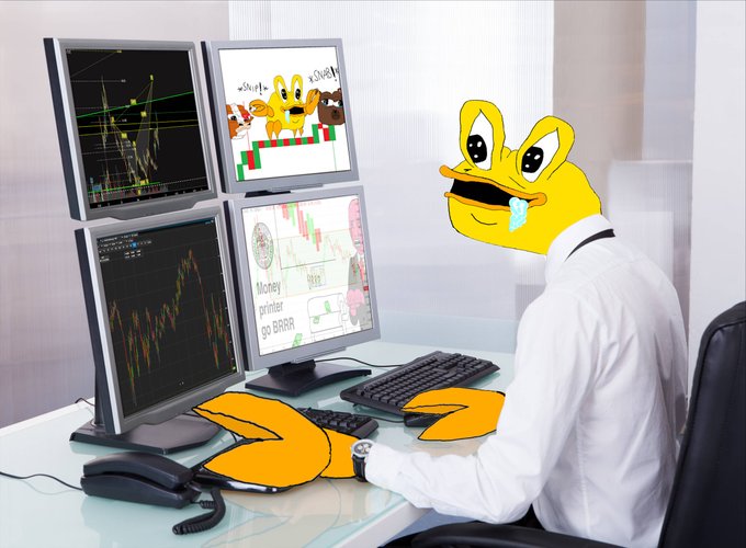A person in a white shirt sitting at a desk with four monitors, edited with a cartoon duck head and orange bird-like hands, with screens showing crypto charts and a 'Money printer go BRRR' meme.