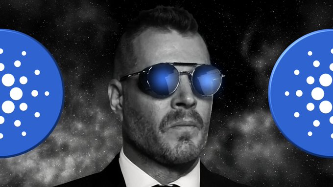 A black-and-white photo of cryptocurrency influencer Alex Becker wearing reflective sunglasses, flanked by two blue Cardano ($ADA) logos against a starry background, illustrating his bold claim that the current ADA price represents a "generational bottom" for Cardano holders.
