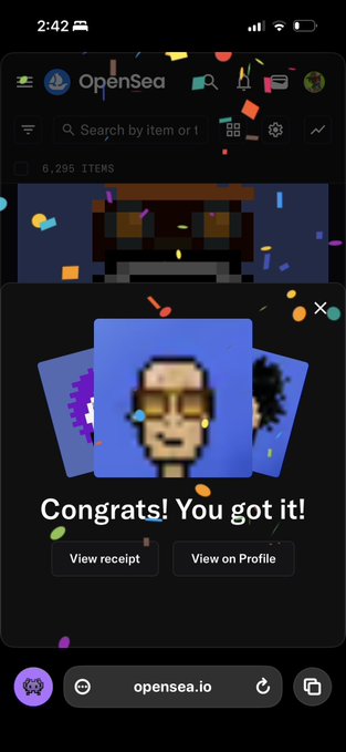 A mobile screenshot of OpenSea showing a 'Congrats! You got it!' NFT purchase confirmation message with confetti animation.