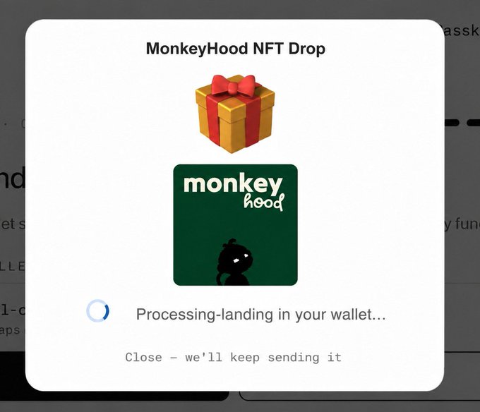 A notification popup titled "MonkeyHood NFT Drop" showing a gift box icon and the MonkeyHood logo, with the status "Processing-landing in your wallet..." and "Close - we'll keep sending it".