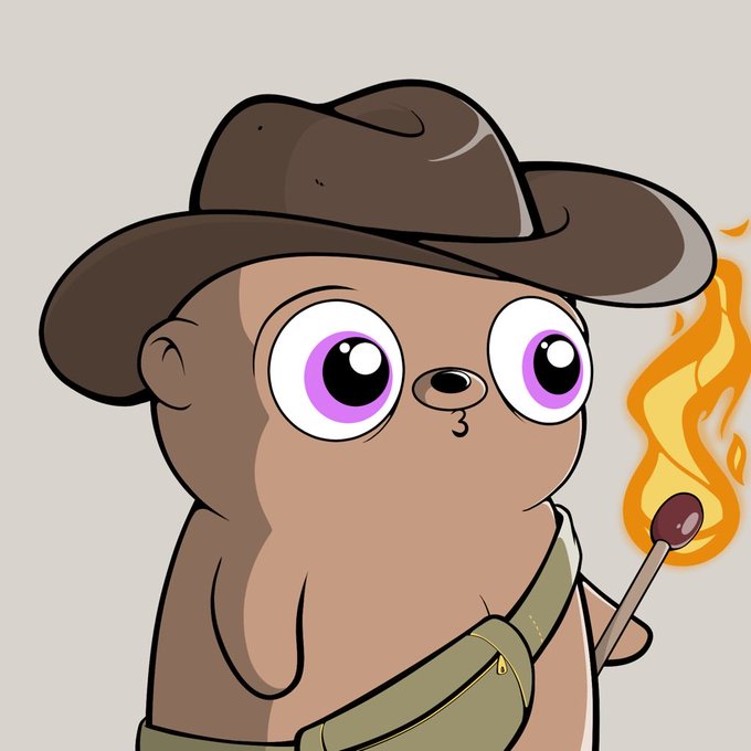 A cartoon illustration of a brown bear-like character wearing a brown cowboy hat, with large purple eyes and a green satchel, holding a burning match in its paw.