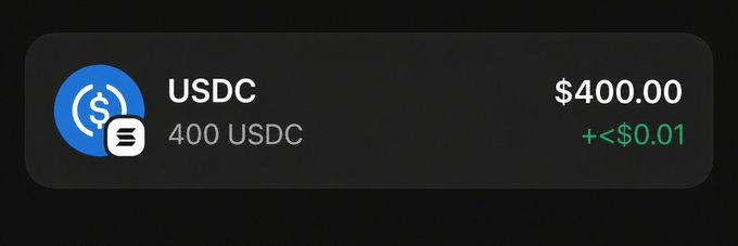 The image from the social media post advertises a $400 giveaway of SOL. It displays a specific amount of USDC cryptocurrency and its equivalent value in US dollars.