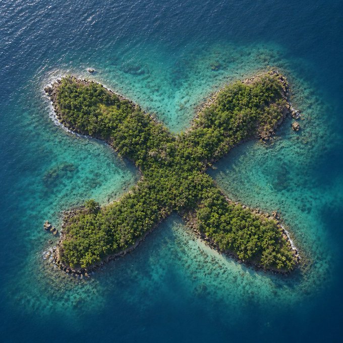 An aerial view shows a tropical island formed into an X shape, covered with lush green vegetation and surrounded by turquoise waters and coral reefs. The image's striking X shape and vivid blue sea evoke the idea of a hidden, profitable treasure spot, fitting the caption's suggestion that this is the best place to harvest gains.