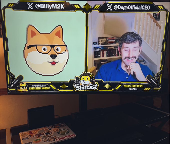 A monitor displays a livestream titled 'The Shiftcast' featuring a pixel art dog and a smiling man with a mustache, with Twitter handles '@BillyM2K' and '@DogeOfficialCEO' visible.