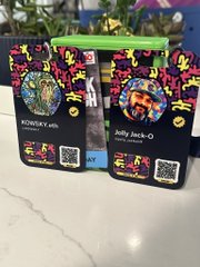 A close-up photo of three Kidz Bop concert ticket lanyards/cards, featuring 'Keedron Bryant' and 'Salty Jack-O' as visible artist names.