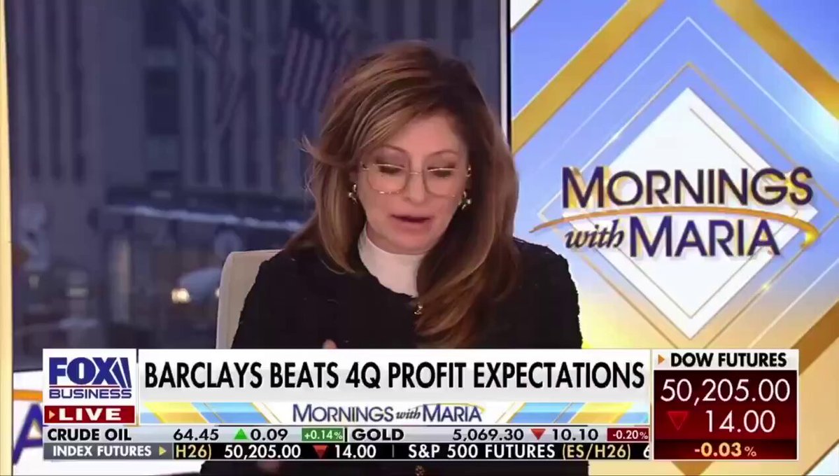 The image shows a woman sitting at a desk, talking about banking giant Barclays' plans for adopting Bitcoin and crypto assets as part of their business strategy. The TV screen displays this information along with other financial news and figures related to the topic.