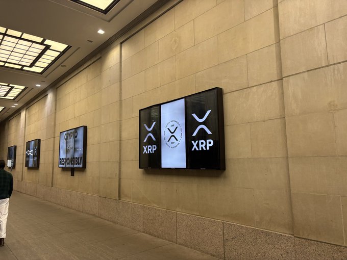 Digital displays featuring the XRP branding and Ripple logo light up the hallway, mirroring the same welcoming XRP presence that greeted attendees at XRP Vegas earlier this year, as anticipation builds for the upcoming Ripple Swell and XRPL Apex event in NYC.