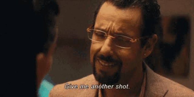 A meme featuring Adam Sandler wearing glasses and a tan jacket, with the subtitle 'Give me another shot.'