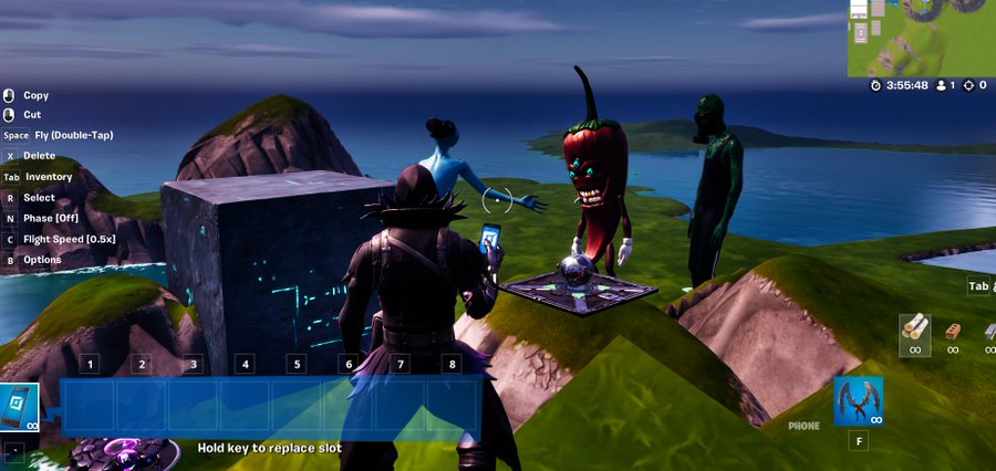A screenshot from the video game Fortnite shows a character standing on a grassy landscape near water, facing a strange glowing portal and several eerie figures, with the game's building controls visible on the left.