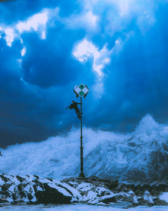 A surreal digital artwork depicting a person climbing a pole holding a navigation sign, with massive blue ocean waves and dramatic clouds in the background.