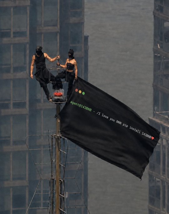 An artistic image of two masked figures on a tower or antenna platform holding a black flag with the text 'agent@143BNB ~ /I love you BNB pip install 143BNB' alongside terminal-style command prompt dots.