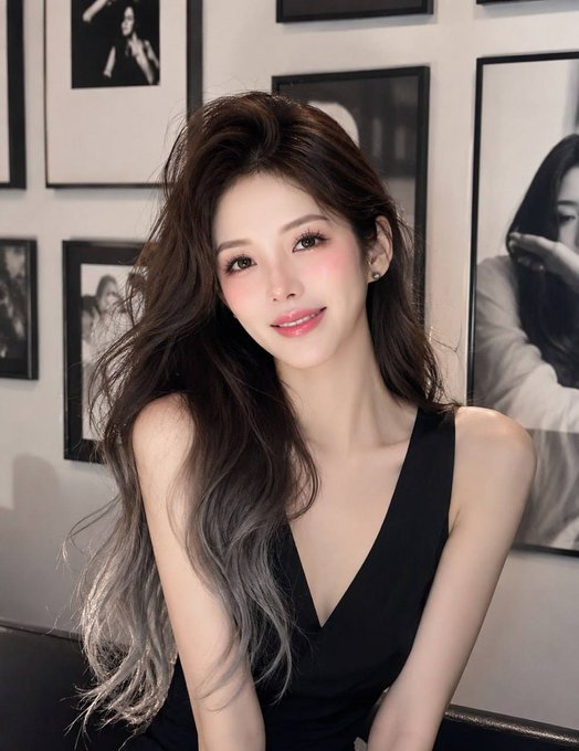A stylish woman with long, voluminous dark hair posing in a black sleeveless top against a wall of framed black-and-white photographs.

The image doesn't contain any text or numbers, but its polished, aspirational aesthetic complements the post's question about achieving financial freedom in Web3—visually representing the lifestyle and confidence that financial milestones can bring.