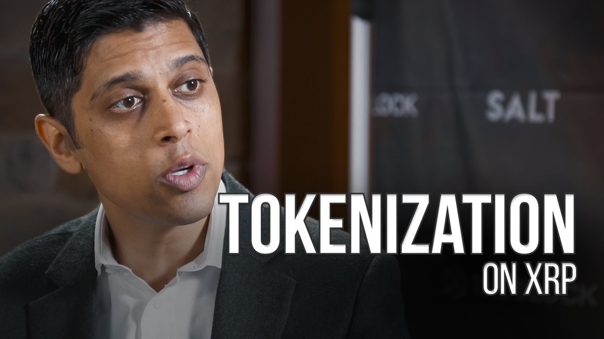 A man in a dark blazer speaks in an interview setting, with 'TOKENIZATION ON XRP' displayed as the title text.