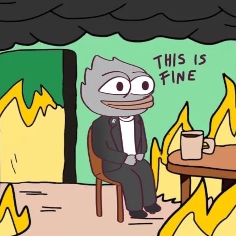 The classic "This Is Fine" meme featuring a cartoon dog in a suit sitting calmly at a table with a coffee mug while his room burns around him, with dark smoke filling the ceiling.
