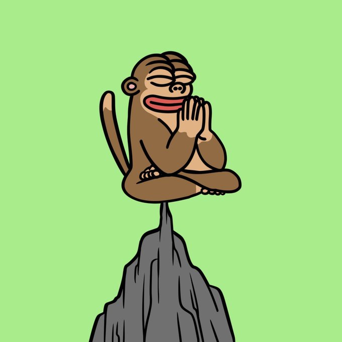Cartoon illustration of a smiling brown monkey with closed eyes and hands clasped in a prayer/namaste gesture, perched atop a dark rocky peak against a solid light green background.