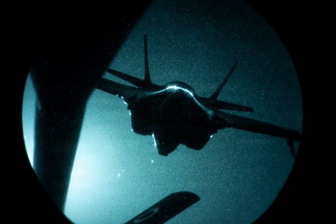 A silhouette of a stealth aircraft seen through a circular porthole or scope, evoking the secretive, "refuses to elaborate" tone of the post by visually representing covert surveillance or classified intel—fitting for teasing an under-studied, high-stakes opportunity in Hyperliquid and digital assets.