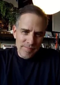 A middle-aged man with a goatee, wearing a dark shirt, is seen in what appears to be a home office setting with a globe lamp in the background. The image likely accompanies an announcement or interview segment featuring Hunter Biden sharing his Bitcoin price forecast for 2028.